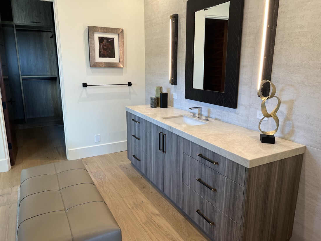 Custom wood bathroom vanity beside a walk-in closet, San Diego